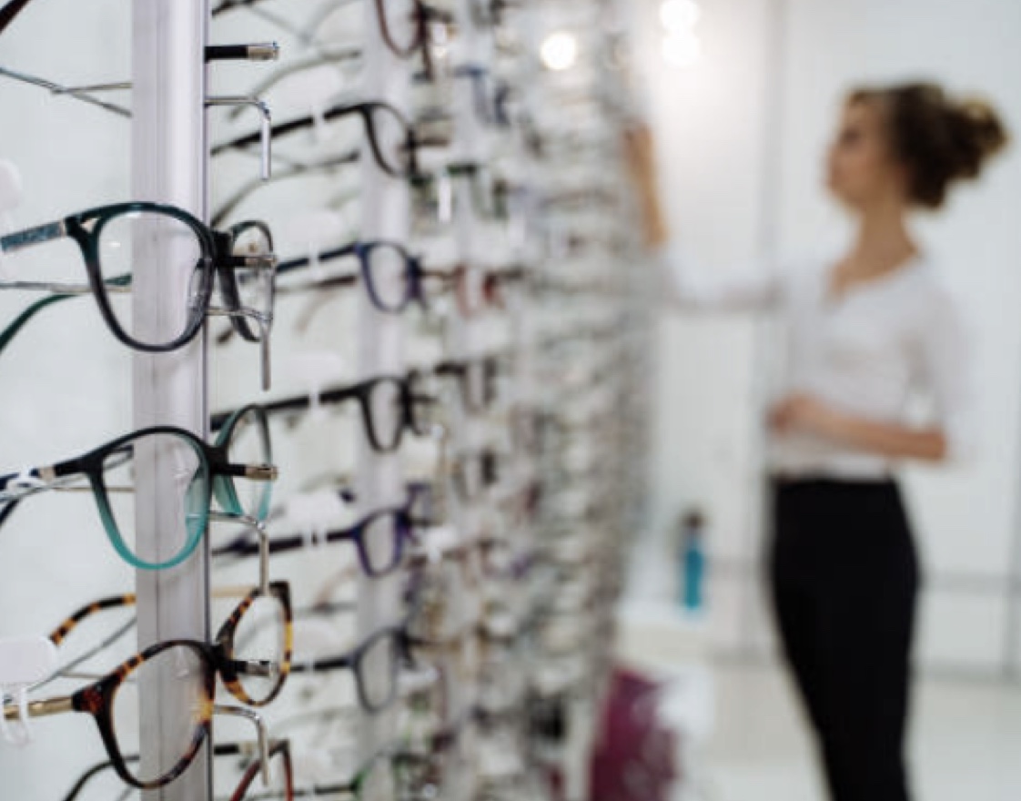Woman selecting eye glasses