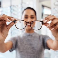 Woman looking at glasses