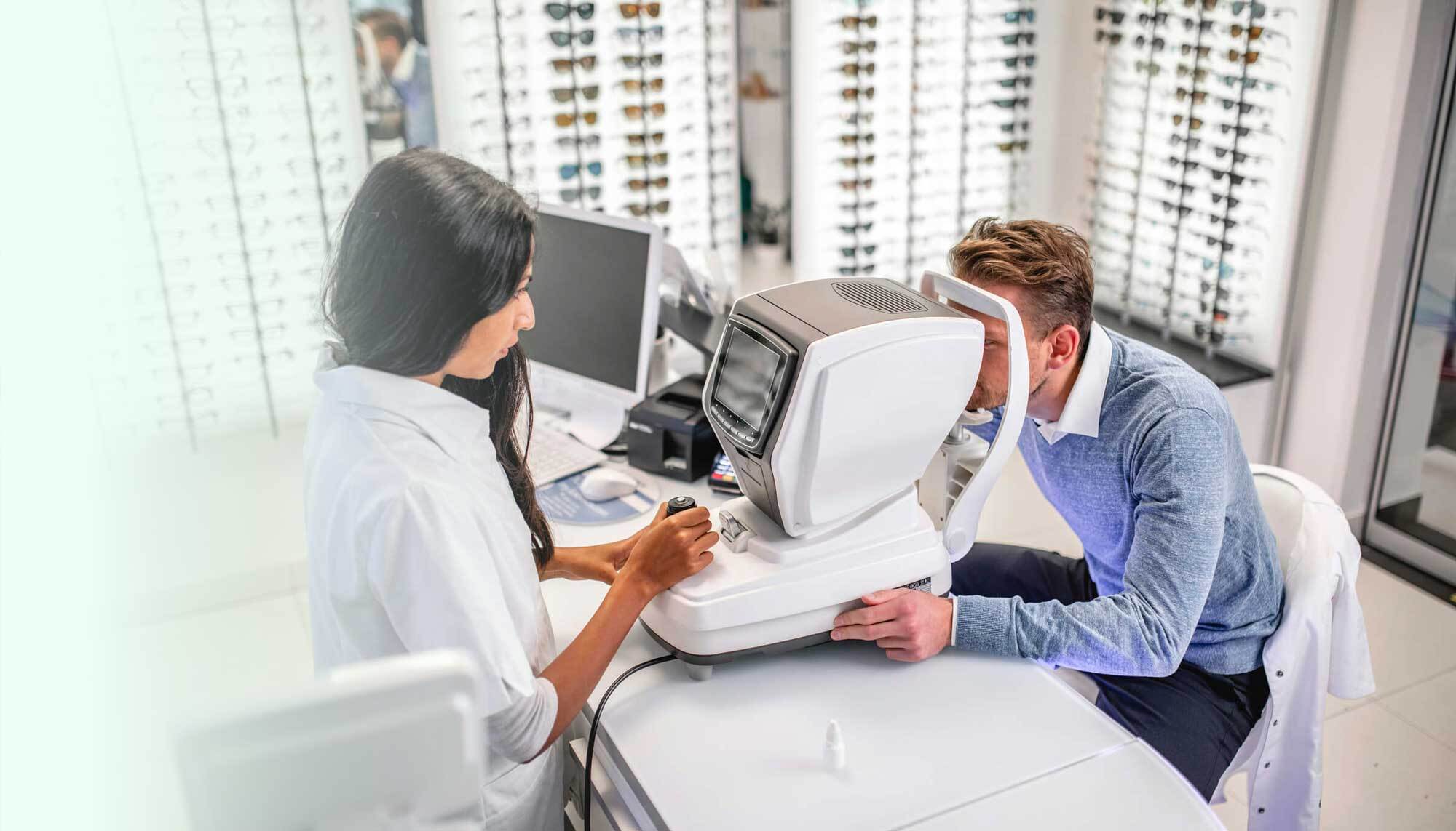Doctor performing video assisted eye exam
